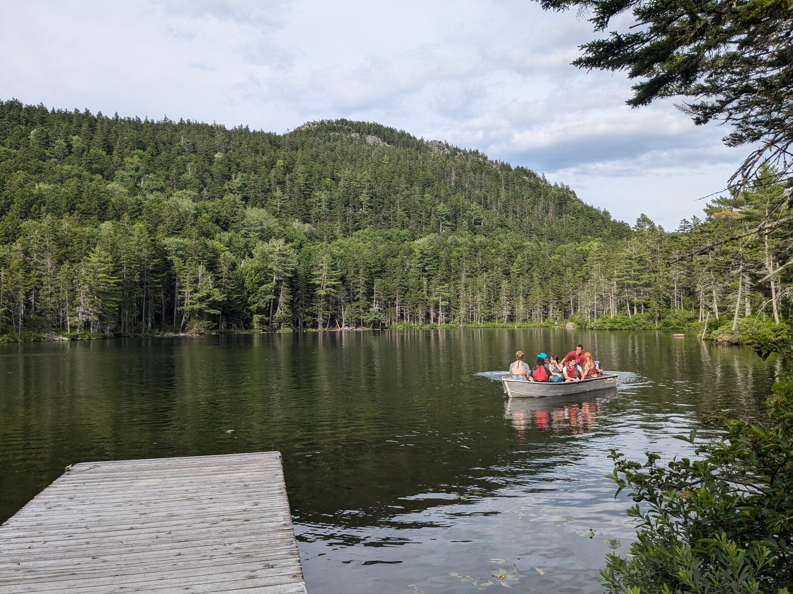 Teen Campers in a motorboat at Borestone Mountain