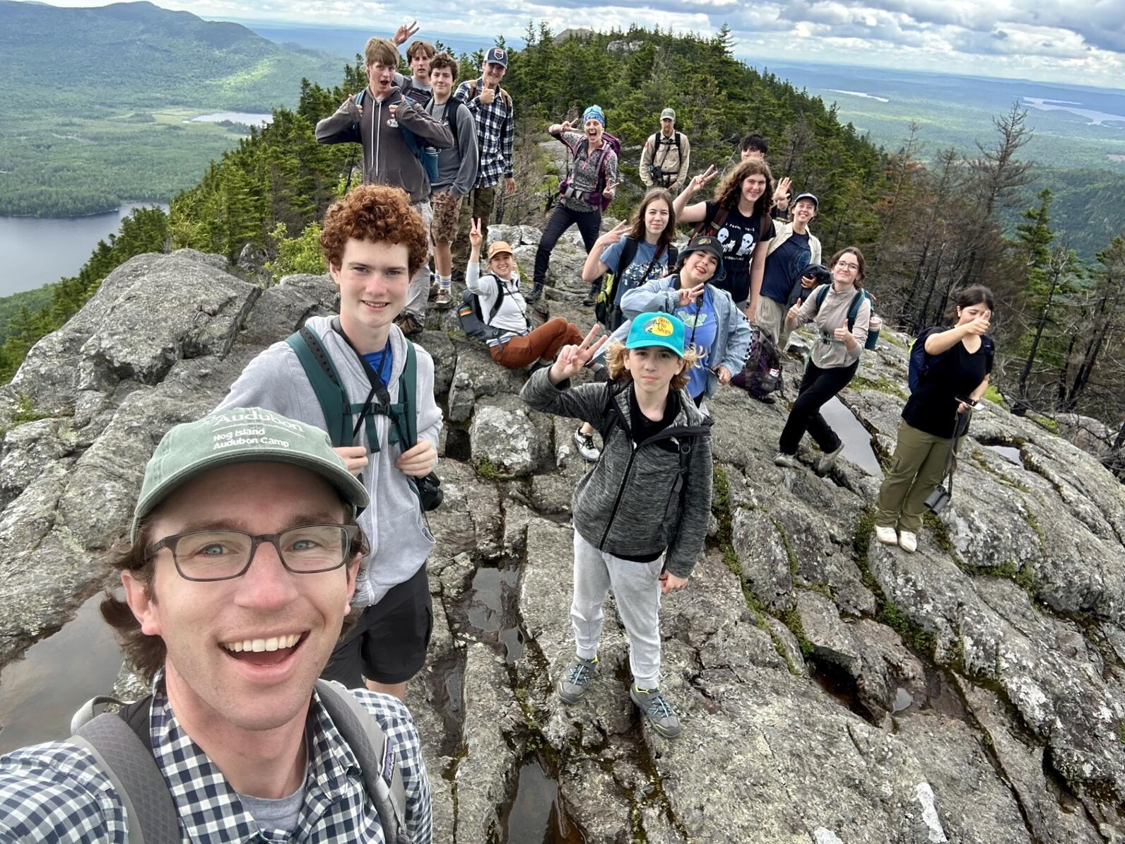 Teen campers at the summit of Borestone Mountain. Teen campers at the summit of Borestone Mountain.